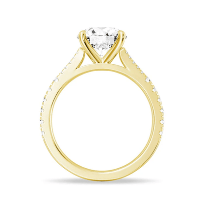 Angled view of Round Cut Split Shank Moissanite Engagement Ring in Yellow Gold - Novelle Vow