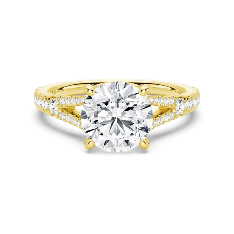 Yellow gold round brilliant cut moissanite engagement ring with split shank and pave accents