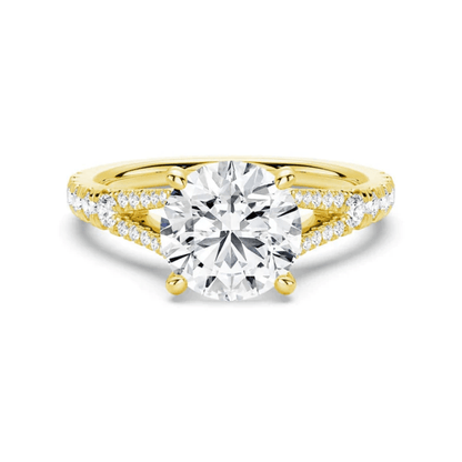 Yellow gold round brilliant cut moissanite engagement ring with split shank and pave accents