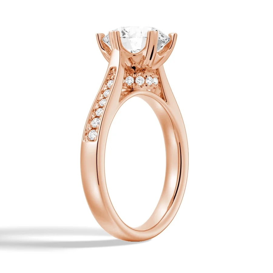 Rose gold round moissanite engagement ring 3/4 perspective view showing hidden halo and pave shank