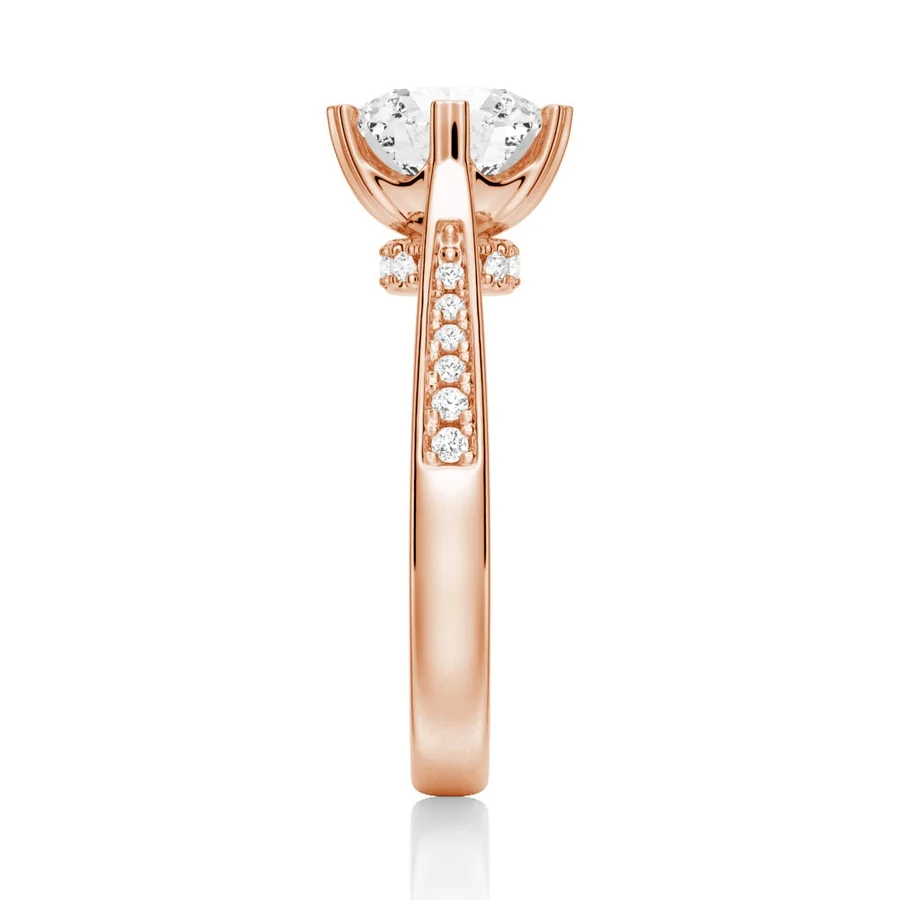 Rose gold round moissanite ring side view displaying pave shank and hidden collar details