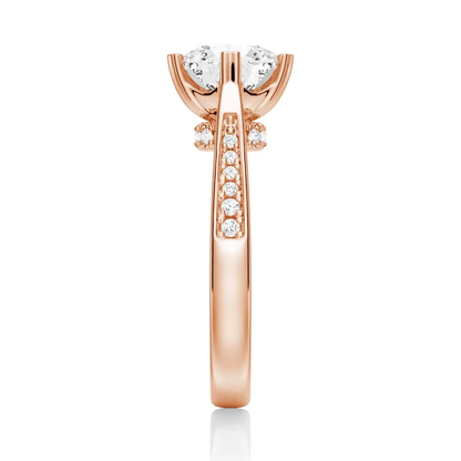 Rose gold round moissanite ring side view displaying pave shank and hidden collar details