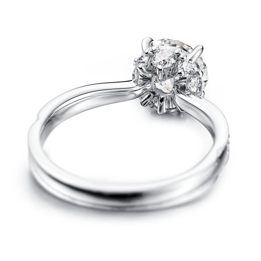 Underside angle view showcasing hidden halo under-gallery setting and smooth inner ring band