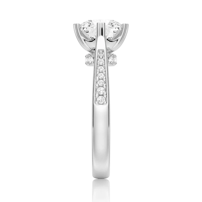 White gold round moissanite ring side profile view displaying pave shank