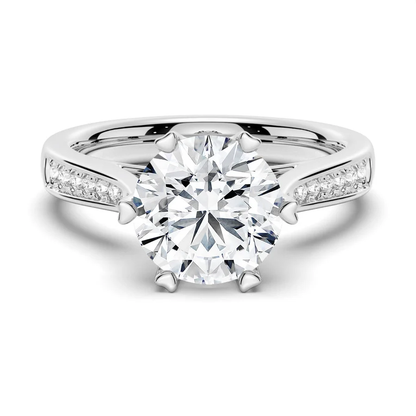 NOVELLE VOW white gold round moissanite engagement ring top view with pave side stones