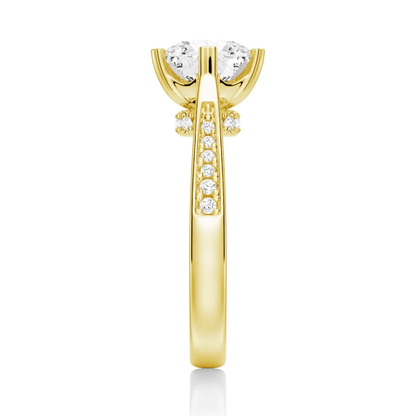 Yellow gold round moissanite ring side view displaying pave band and hidden accents