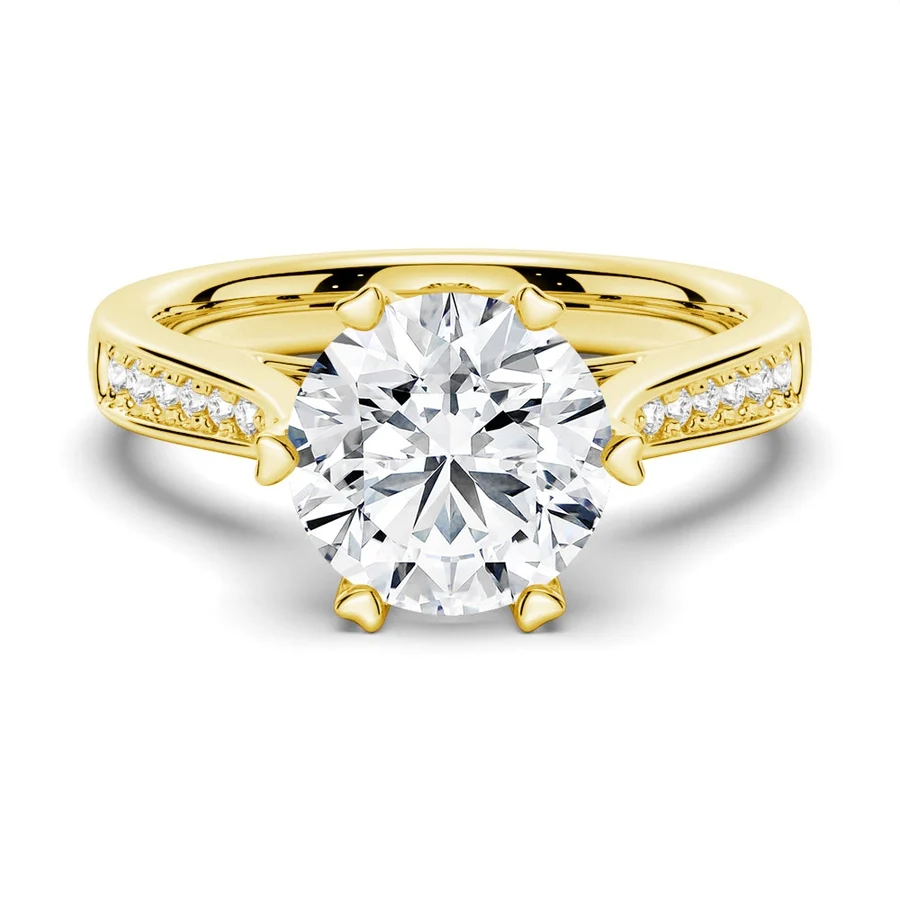 Yellow gold round moissanite engagement ring top view with pave side stones