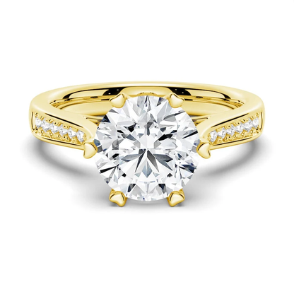 Yellow gold round moissanite engagement ring top view with pave side stones