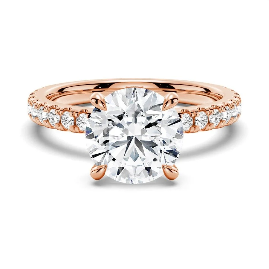 Front view of round cut moissanite pave engagement ring in rose gold