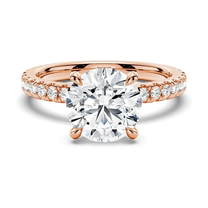 Front view of round cut moissanite pave engagement ring in rose gold