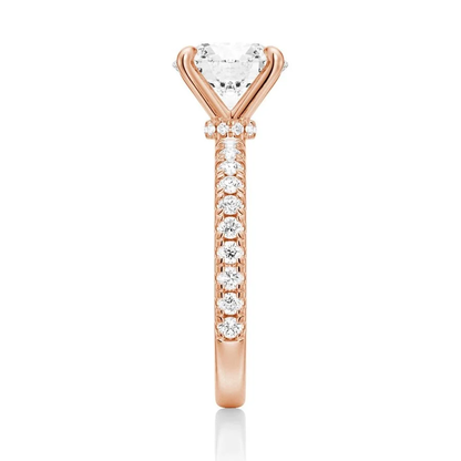 Vertical side view showing 2mm pave band on yellow gold moissanite engagement ring