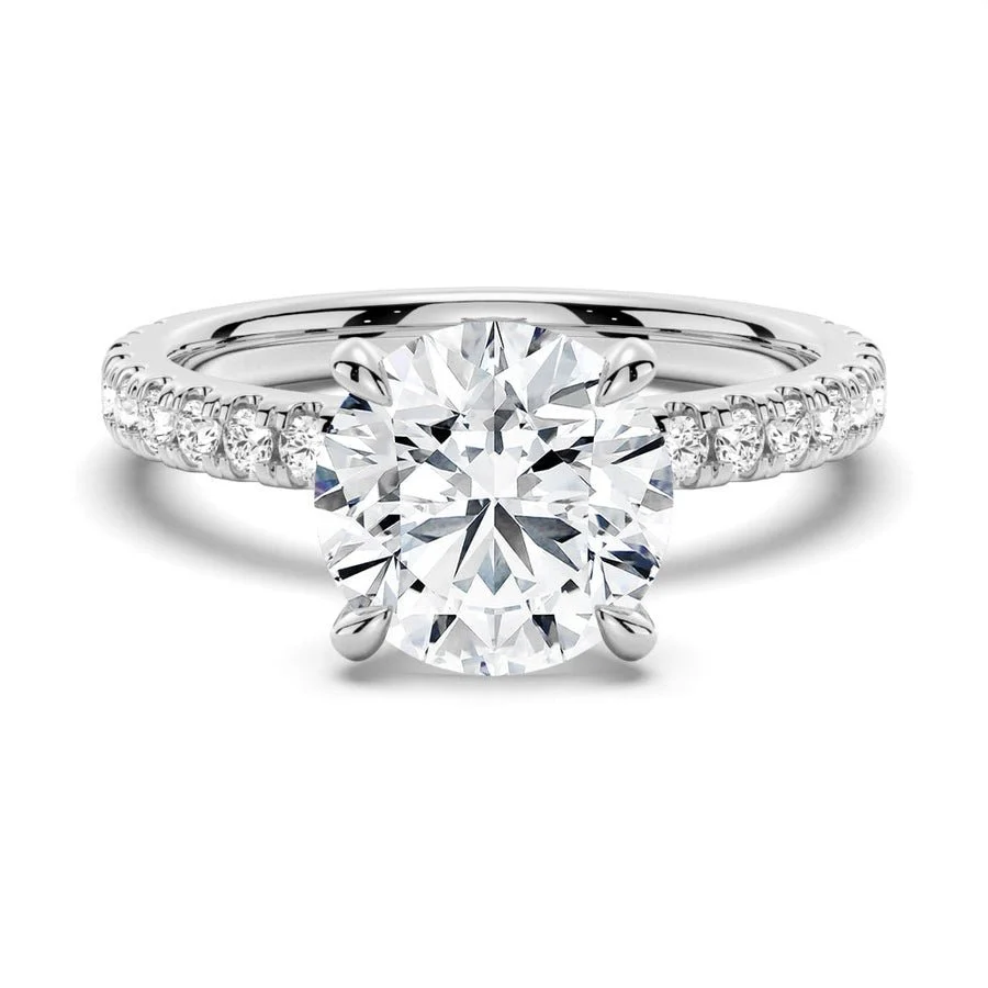 NOVELLE VOW front view of round cut DEF moissanite engagement ring with pave band in white gold