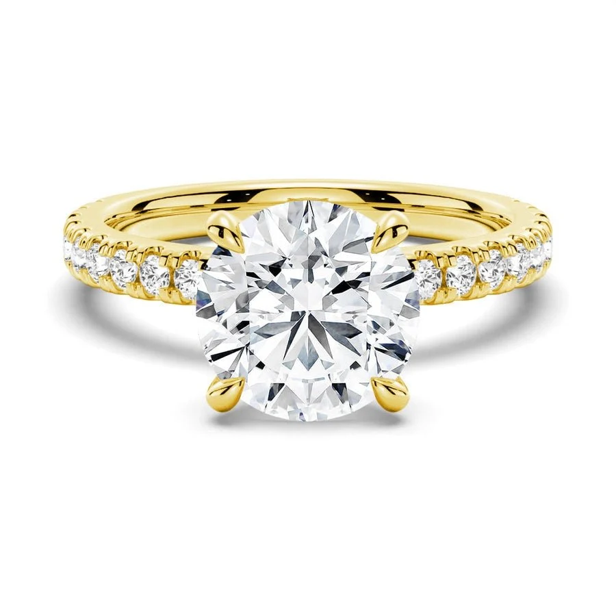 Front view of round DEF moissanite engagement ring with pave band in yellow gold
