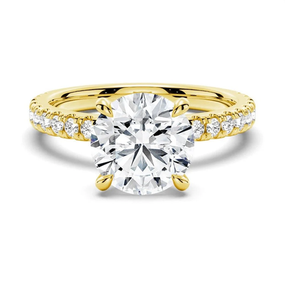 Front view of round DEF moissanite engagement ring with pave band in yellow gold