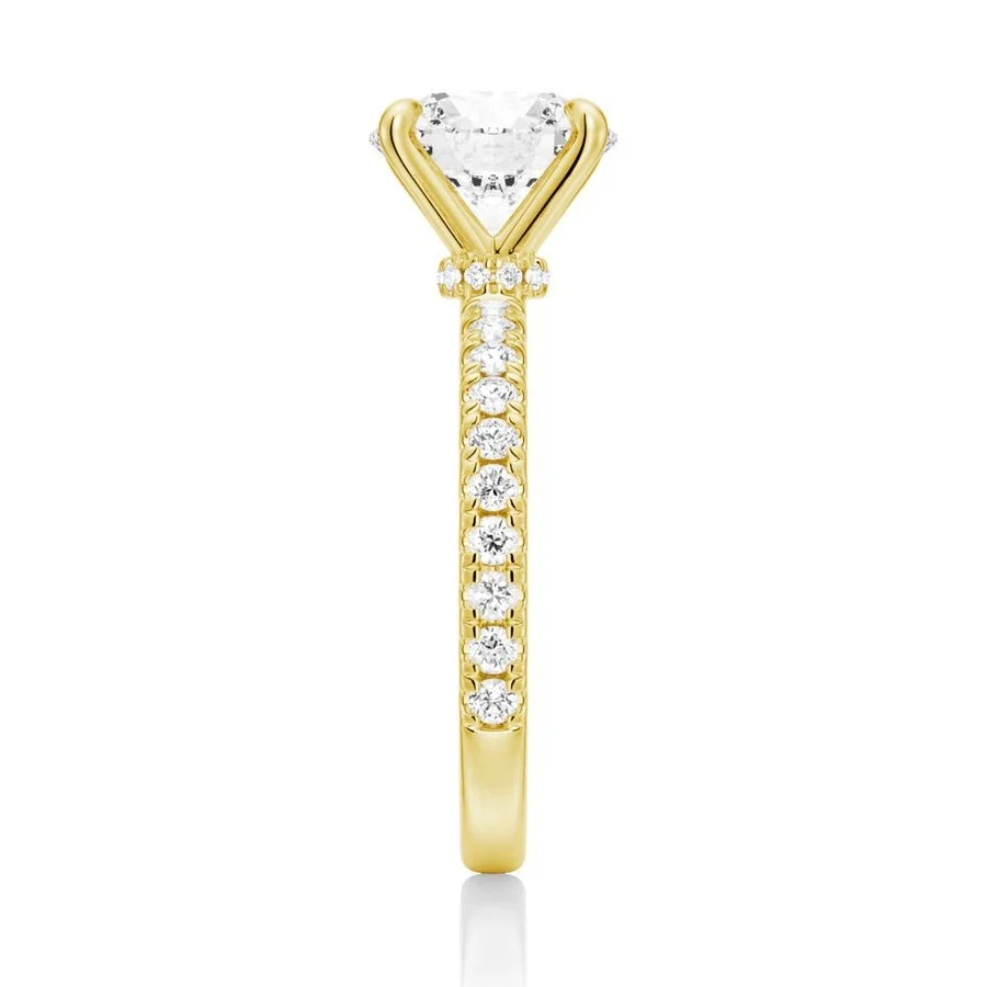 Vertical side view showing 2mm pave band on yellow gold moissanite engagement ring