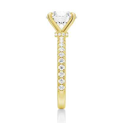 Vertical side view showing 2mm pave band on yellow gold moissanite engagement ring
