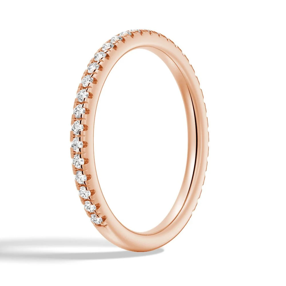 Three-quarter perspective view of 1.7mm round moissanite pave band in rose gold