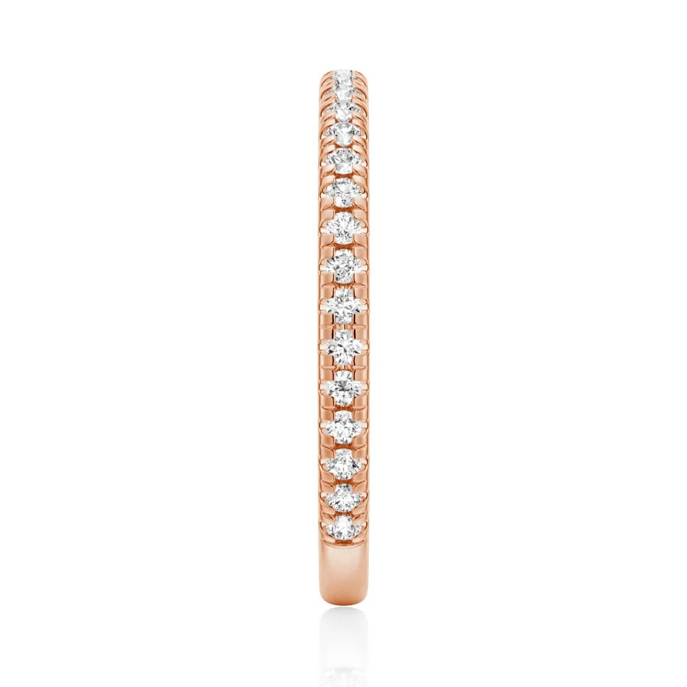 Top view showing 2mm pave set moissanite eternity band in rose gold