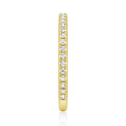 Top view showing 2mm pave set moissanite eternity band in yellow gold