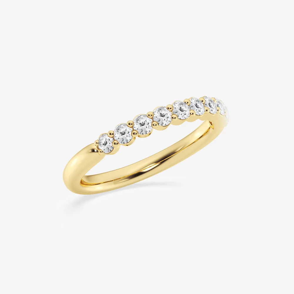 Three-quarter perspective view of round moissanite shared-prong wedding ring in yellow gold