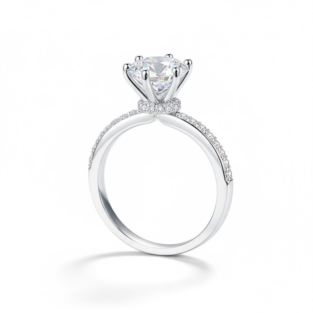 Angled view of Round Moissanite Engagement Ring with Pavé Band and Hidden Halo in White Gold