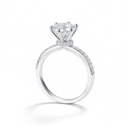 Angled view of Round Moissanite Engagement Ring with Pavé Band and Hidden Halo in White Gold