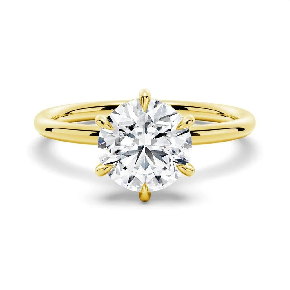 Yellow gold round cut moissanite six-prong solitaire engagement ring top view