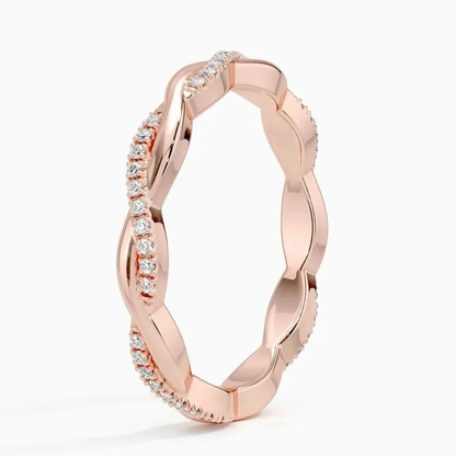Vertical perspective view of 2.5mm scalloped pave moissanite twist ring in rose gold color