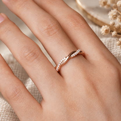 On-hand model view of 0.16-0.20ct TW scalloped pave moissanite twist ring worn on finger