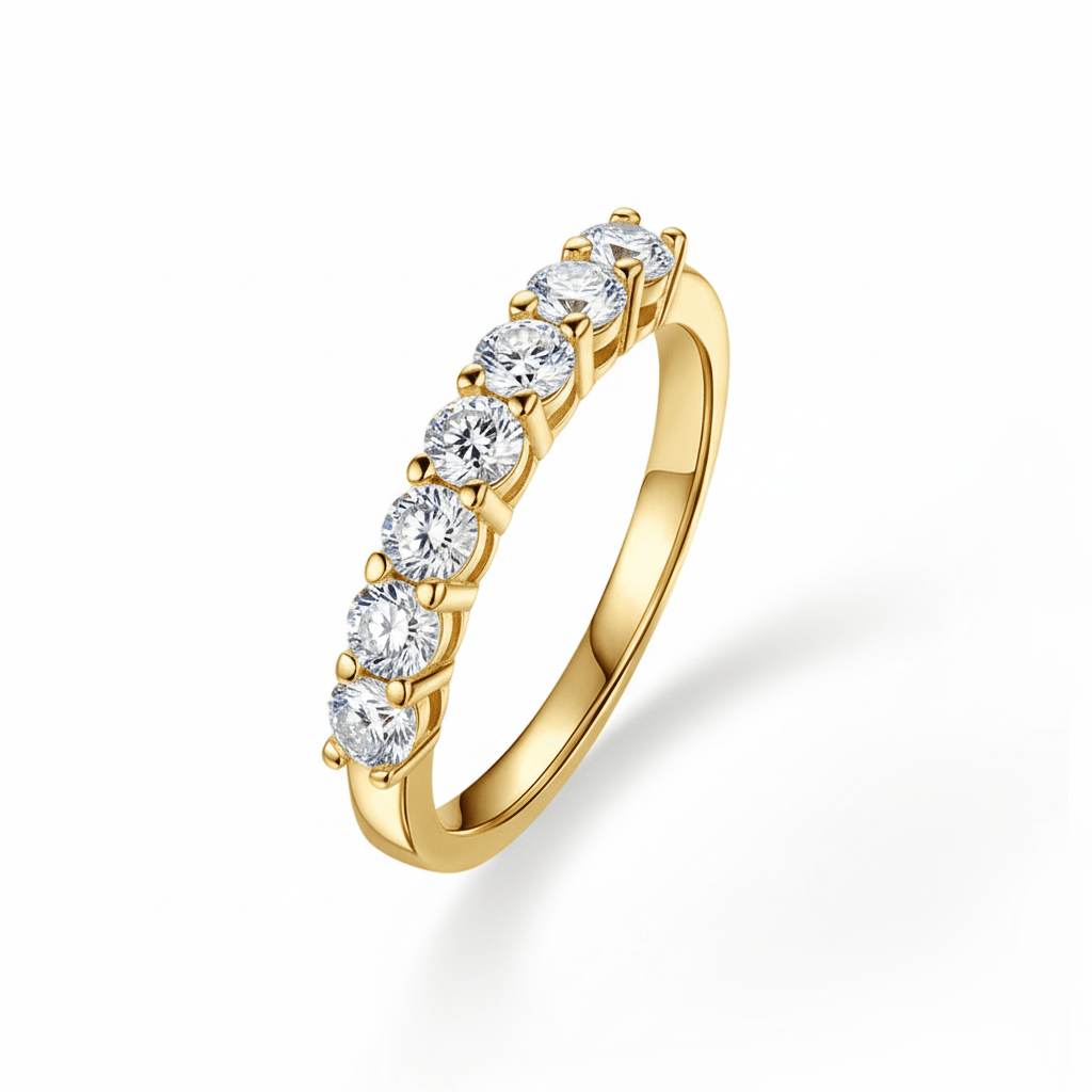Angled profile view of 7 Stone Round Moissanite Wedding Band with Shared Prong Setting in Yellow Gold