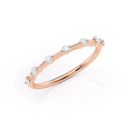 Three quarter angled view of rose gold seven stone moissanite ring