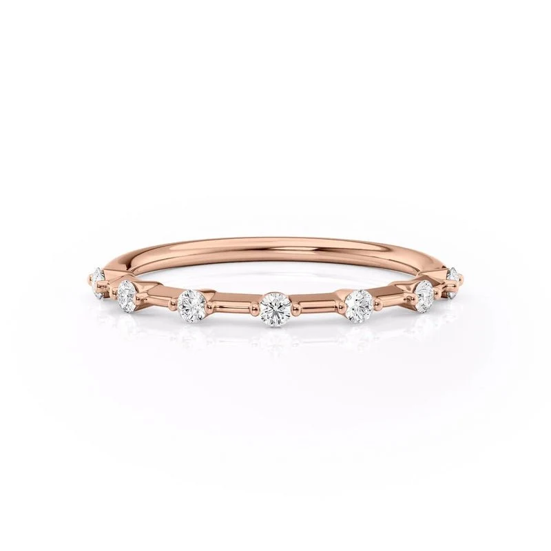 Front view of rose gold seven stone round moissanite wedding band
