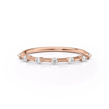 Front view of rose gold seven stone round moissanite wedding band