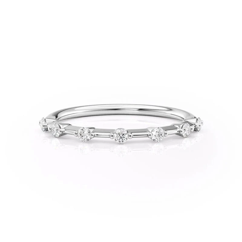 NOVELLE VOW front view of white gold seven stone round moissanite wedding band