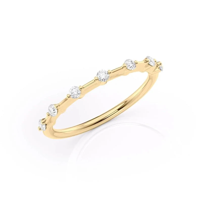 Three quarter angled view of yellow gold seven stone moissanite ring