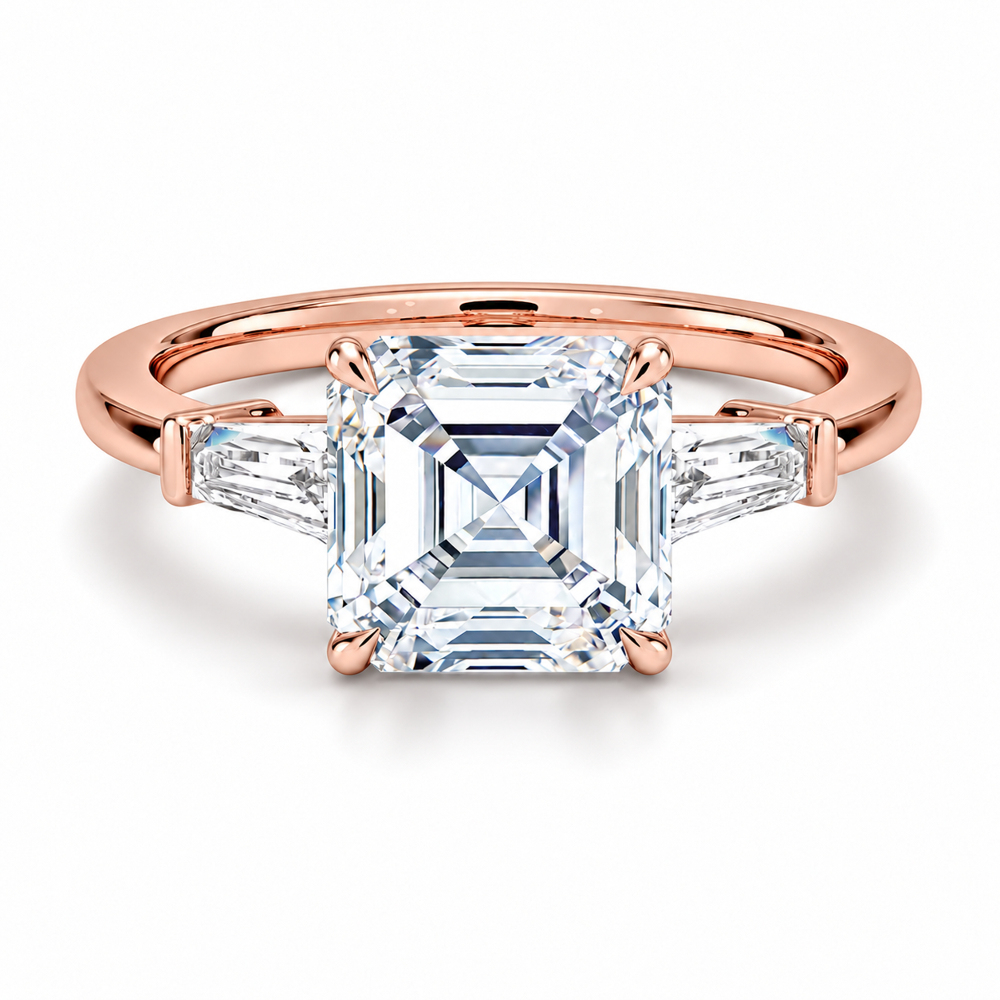 Rose gold asscher cut moissanite three-stone engagement ring top view with tapered baguette side stones