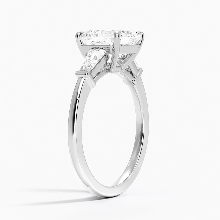 White gold asscher cut moissanite three-stone engagement ring 3/4 side perspective view showing claw prongs