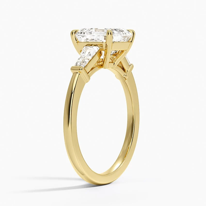 Yellow gold asscher cut moissanite three-stone engagement ring 3/4 side perspective view showing claw prongs