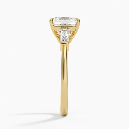 Yellow gold asscher cut moissanite three-stone engagement ring direct side profile view showing bar set side stones