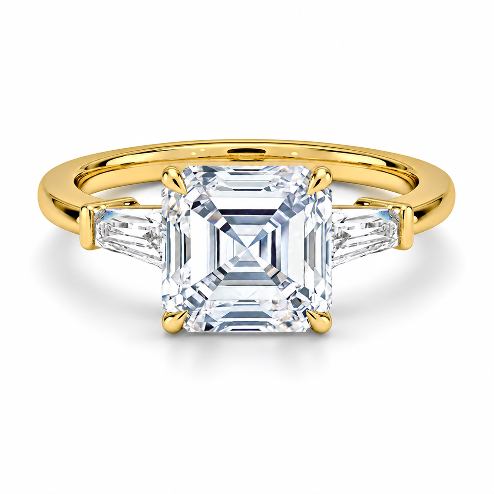 Yellow gold asscher cut moissanite three-stone engagement ring top view with tapered baguette side stones