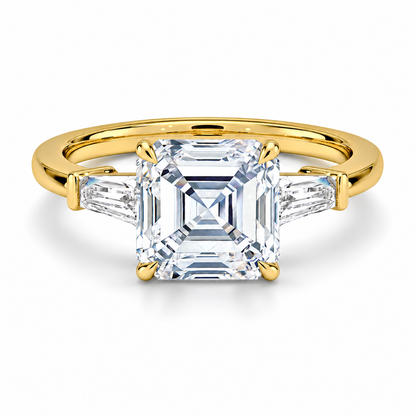 Yellow gold asscher cut moissanite three-stone engagement ring top view with tapered baguette side stones
