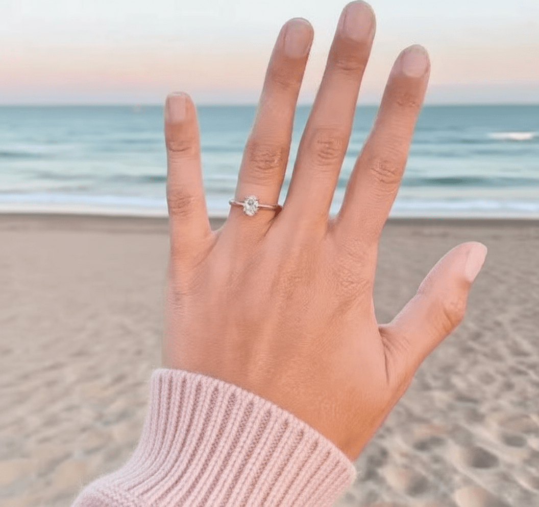 The Classic Oval Solitaire Moissanite Engagement Ring Timeless and Elegant style in White Gold on hand styling