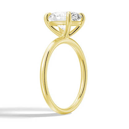 Angled profile view of The Classic Oval Solitaire Moissanite Engagement Ring Timeless and Elegant style in Yellow Gold 