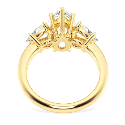 Yellow gold three stone pear moissanite engagement ring side angle profile view
