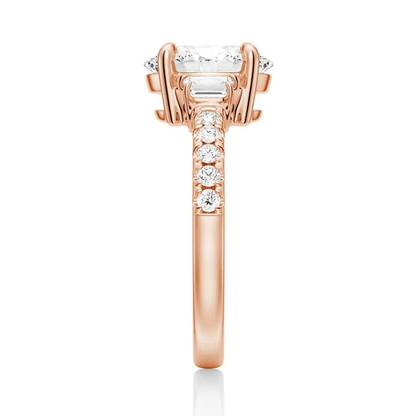 Rose gold three-stone oval moissanite ring side view displaying pave band details