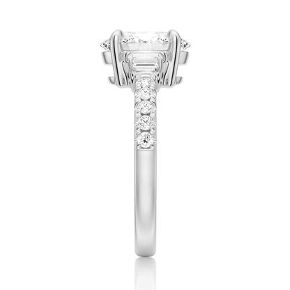 White gold three-stone oval moissanite ring side view displaying pave band details