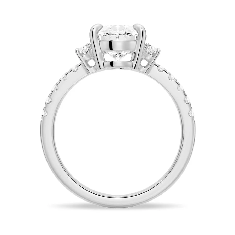 White gold three-stone oval moissanite engagement ring direct side profile setting
