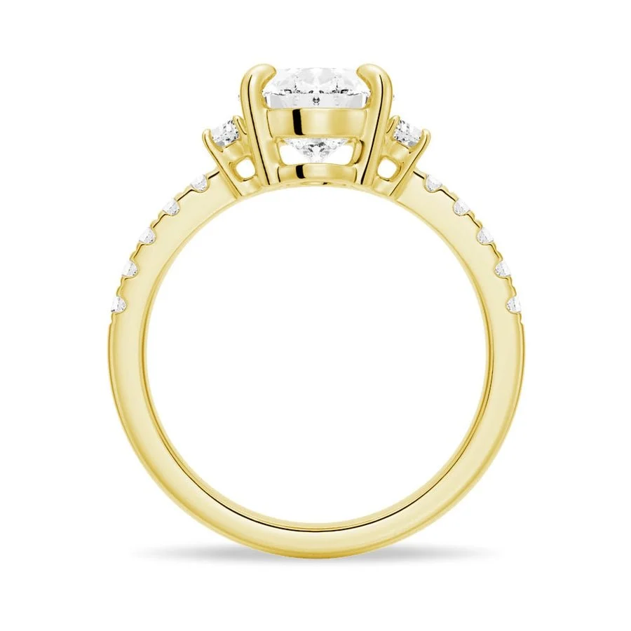 Yellow gold three-stone oval moissanite engagement ring direct side profile setting