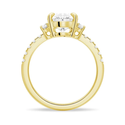Yellow gold three-stone oval moissanite engagement ring direct side profile setting