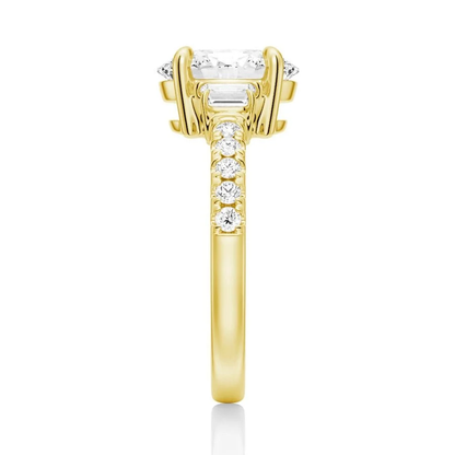 Yellow gold three-stone oval moissanite ring side view displaying pave band details